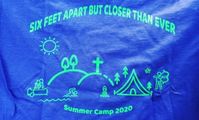 T-shirt front that says "Six Feet Apart but Closer than Ever" and has an outline of a camp saying "Summer Camp 2020" at the bottom.